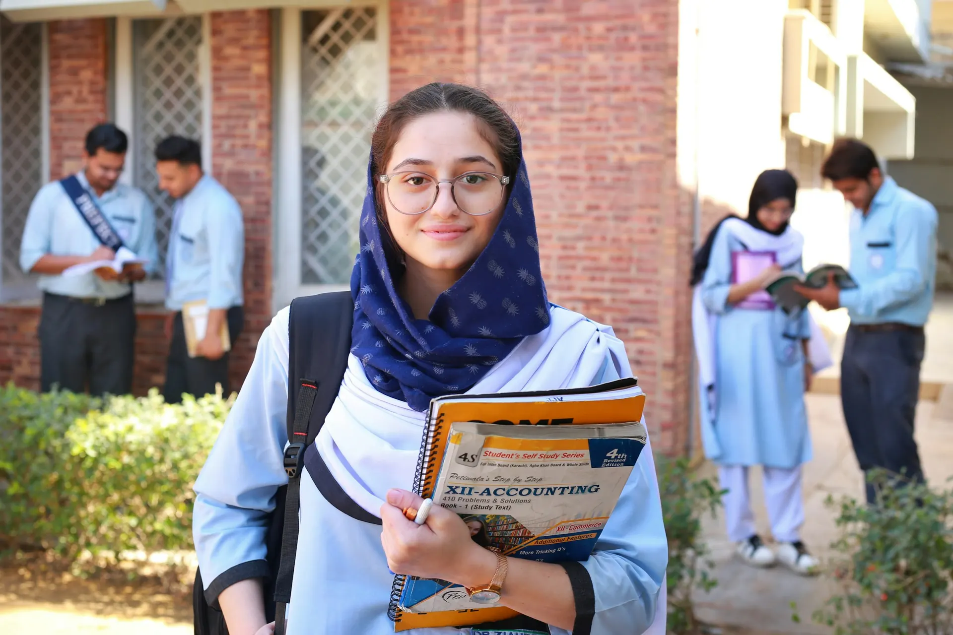 College student holding her books